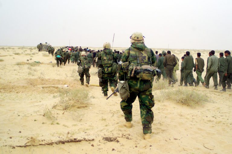 U.S._Marines_with_Iraqi_POWs_-_March_21,_2003