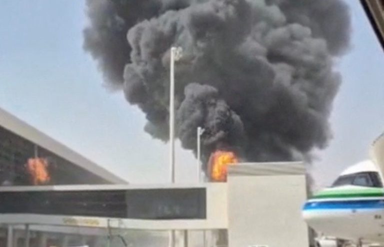Smoke and flames rise from King Khalid Airport, after Yemen’s Iran-backed Houthis said they attacked the airport, in Riyadh